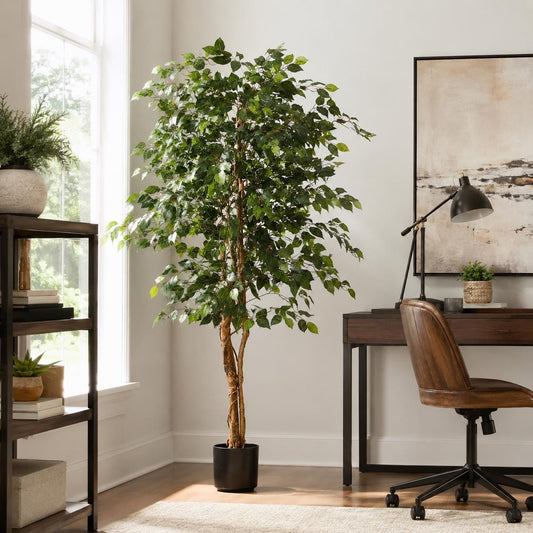 Five-foot artificial olive tree in a white planter styled in a living room