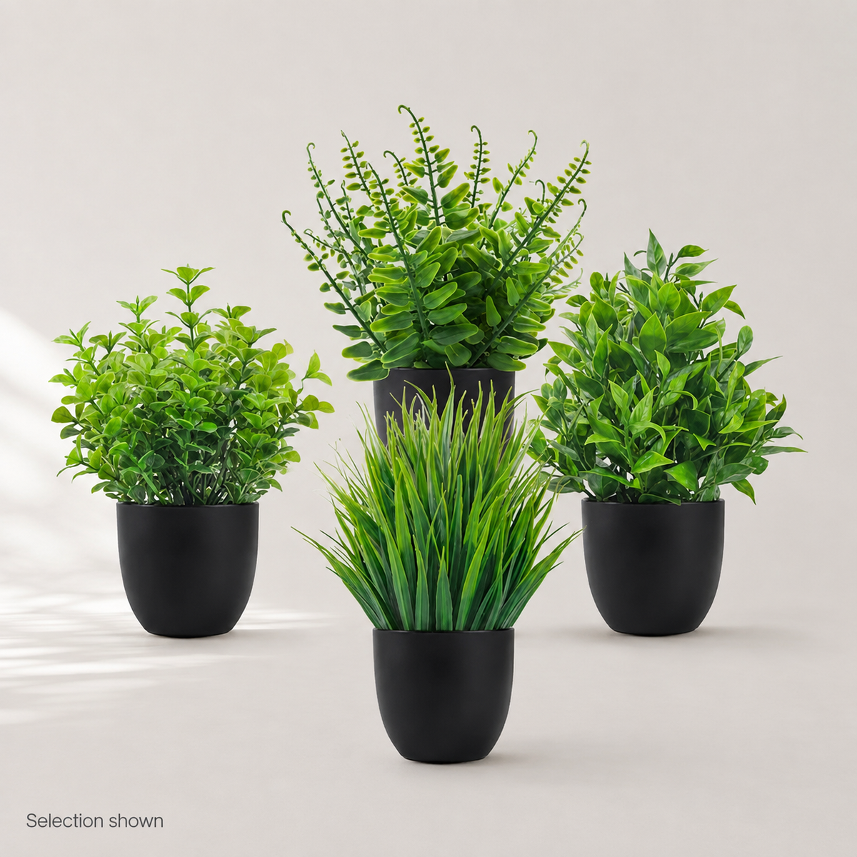 Set of 4 Mini Faux Plants in Black Pots, Assorted Greenery for Desk and Shelf Decor — styled view 9