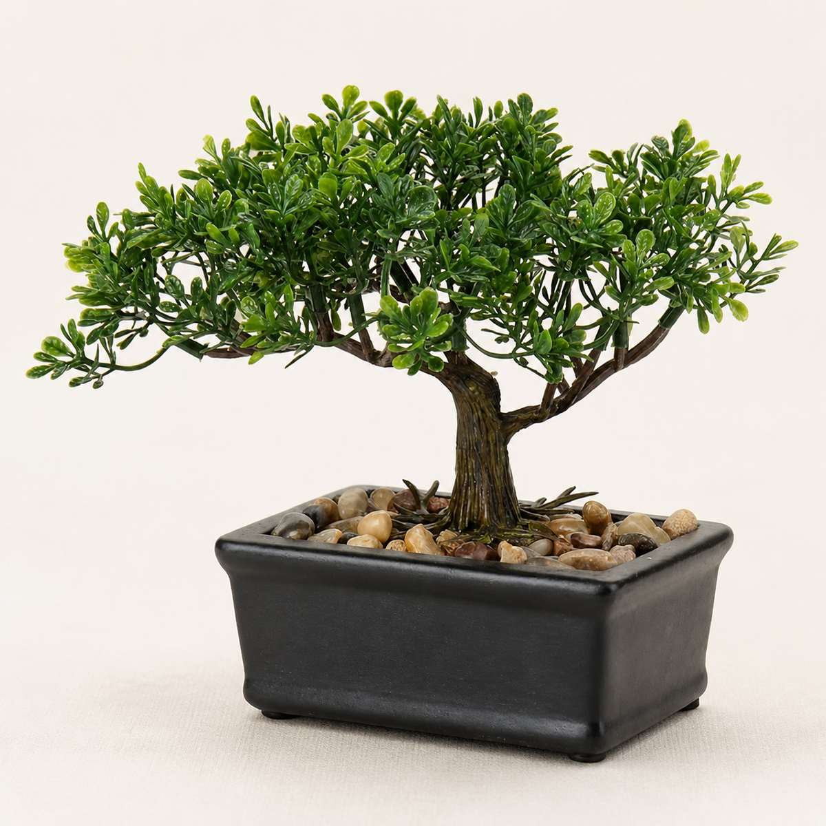 Mini Faux Bonsai Tree in Black Ceramic Pot, Green Tabletop Plant with Pebble Detail — styled product view 1