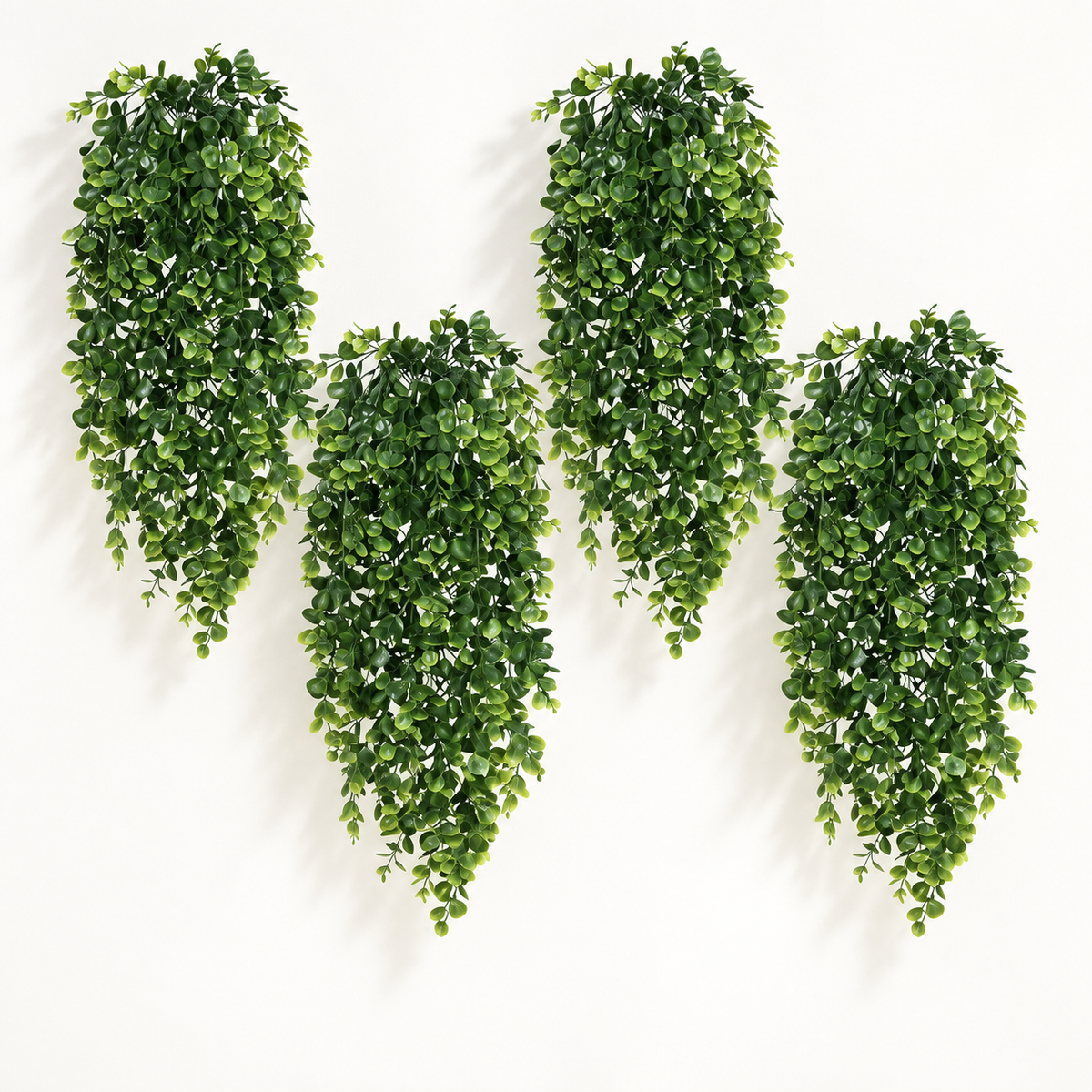 Four trailing artificial greenery bundles with small oval leaves — main