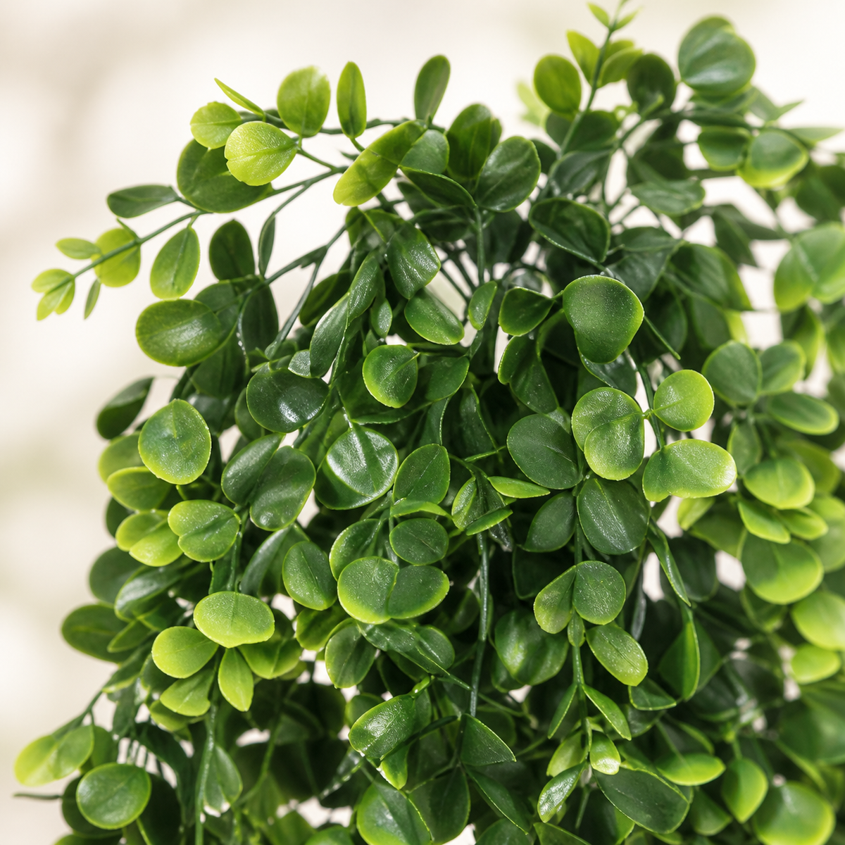 Four trailing artificial greenery bundles with small oval leaves — bloom detail