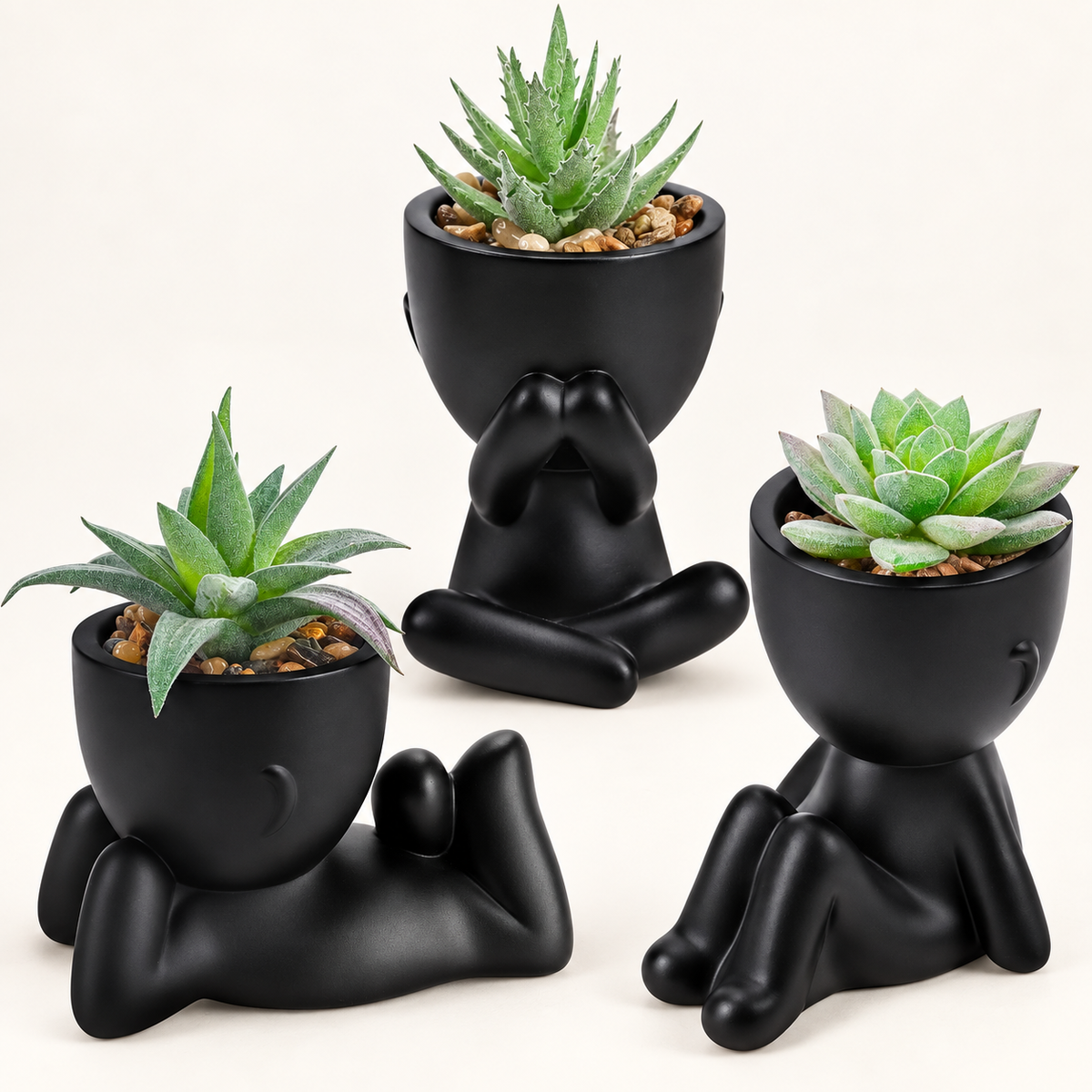 Three faux succulents in black person-shaped pots - main product view