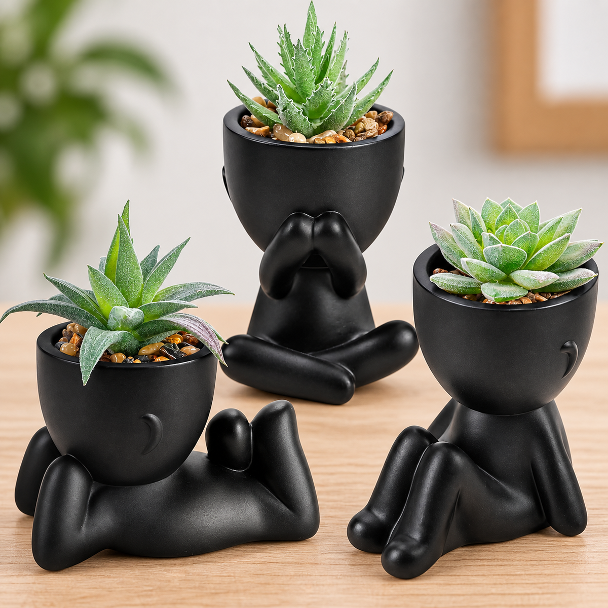Three faux succulents in black person-shaped pots - product detail and inclusion view 03