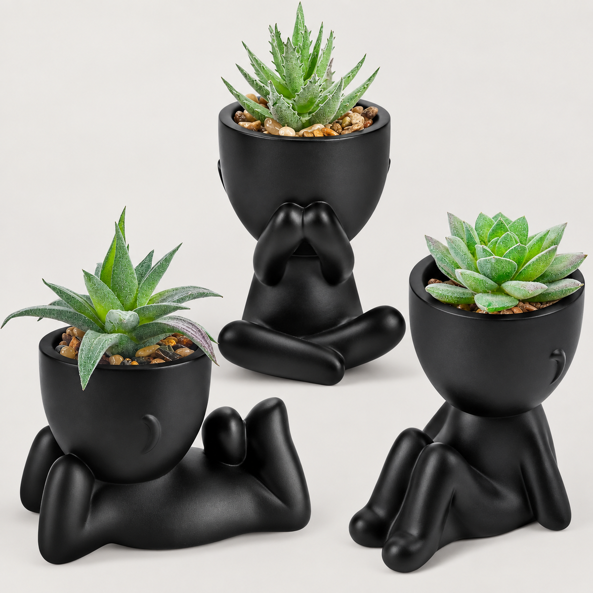 Three faux succulents in black person-shaped pots - product detail and inclusion view 05